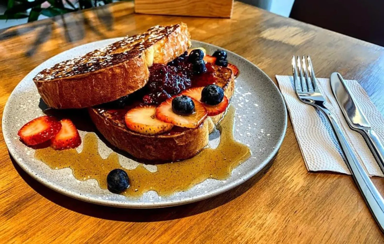 French toast with berries and syrup at the café.