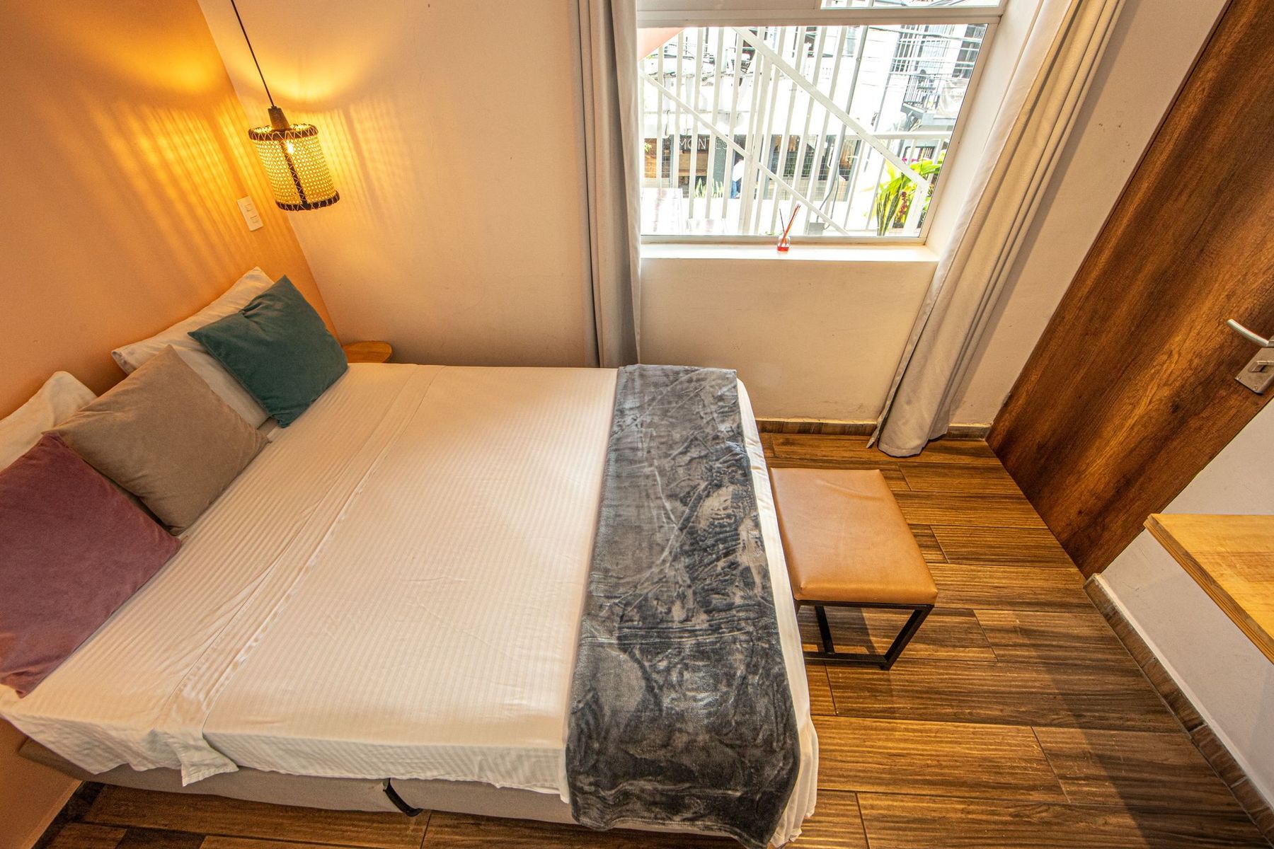 A single room with a desk.